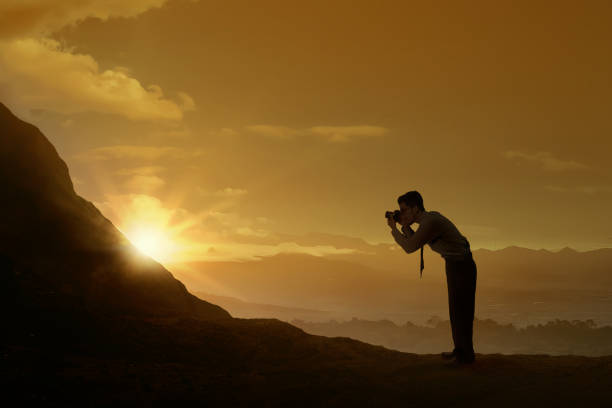 istock Asian businessman take a picture with his camera 1175680800