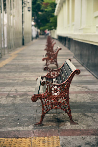 istock A row of Classic Wooden bench 1175681937