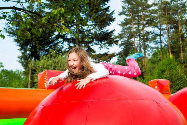 istock Happy Girl on Inflate Castle 1175683439