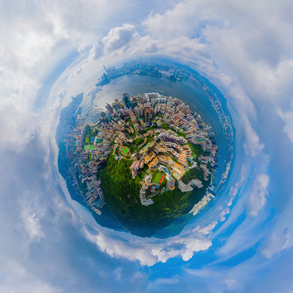 Little planet 360 degree sphere birds eye view. Panoramic view of aerial view of Hong Kong Downtown. Financial district and business centers in technology smart city. Skyscraper buildings at noon.