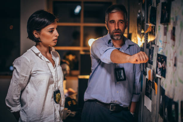 istock Two FBI agents looking for clues 1175684721