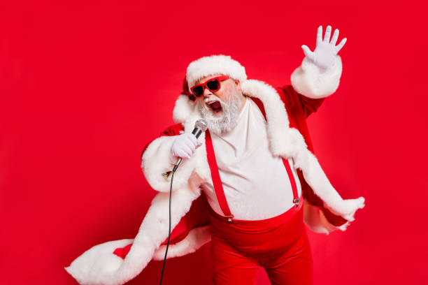 Closeup photo of funny funky wild vocalist screaming in microphone wearing fur coat gloves suspenders isolated bright background Closeup photo of funny funky wild vocalist screaming in microphone, wearing fur coat gloves suspenders isolated bright background microphone photos stock pictures, royalty-free photos & images