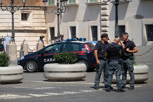 Rome, Italy - August 22, 2019: Policemen outside the Quirinal Palace entrance. The Quirinal Palace (Palazzo del Quirinale) is one of the three official residences of the President of the Republic