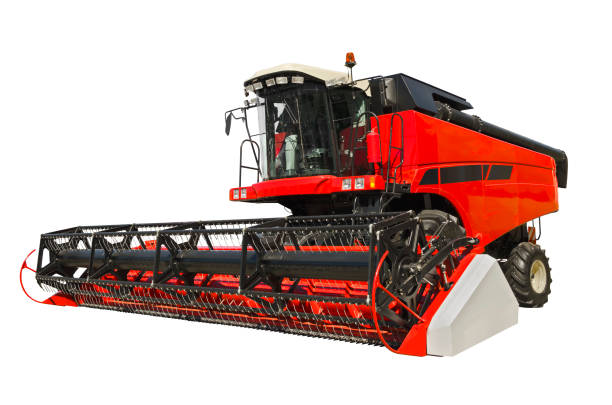 Red agricultural combine, front view Red agricultural combine isolated on a white background combine harvester stock pictures, royalty-free photos & images