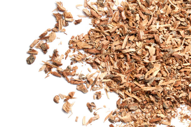 istock Dried chopped oak bark. Isolated on white background. Homeopathy. 1175687633