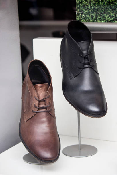 istock Men's shoes in the showcase 1175690400