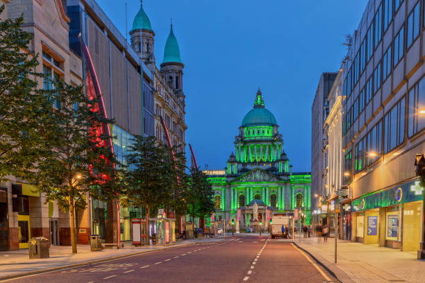 The Belfast City Hall at Donegall Square in Belfast, Northern Ireland at Night The Belfast City Hall from Donegall Pl in Belfast belfast photos stock pictures, royalty-free photos & images