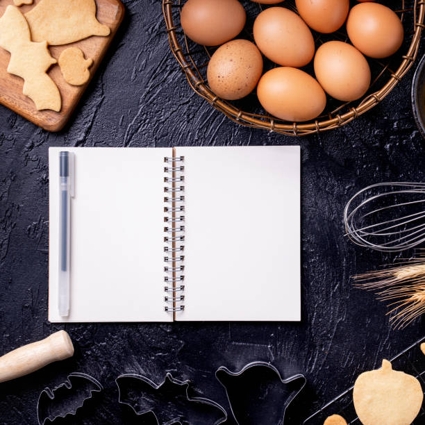 istock Making cookies cookbook recipe design concept, baking ingredients preparation layout with notebook. 1175691119