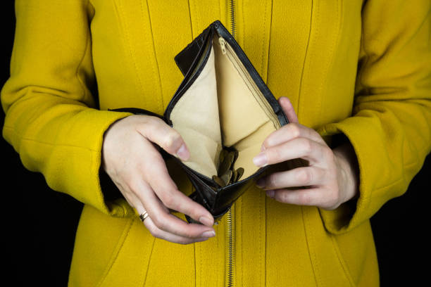 istock Girl holding a blank purse, close-up 1175691323