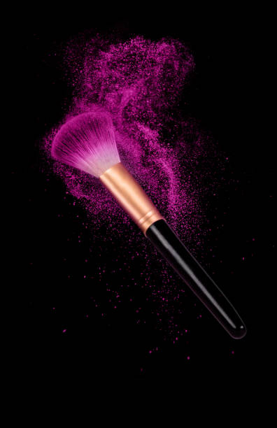 cosmetics brush and explosion colorful makeup powder on black - face powder exploding make up dust imagens e fotografias de stock