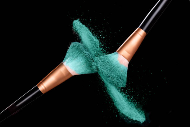 cosmetics brush and explosion colorful makeup powder on black - face powder exploding make up dust imagens e fotografias de stock