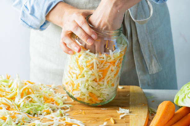istock The preparation process fermentation preservation Sauerkraut on a light background. Natural rustic style. Canned food 1175694417