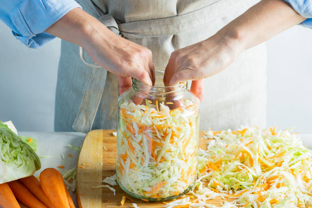 istock The preparation process fermentation preservation Sauerkraut on a light background. Natural rustic style. Canned food 1175694439
