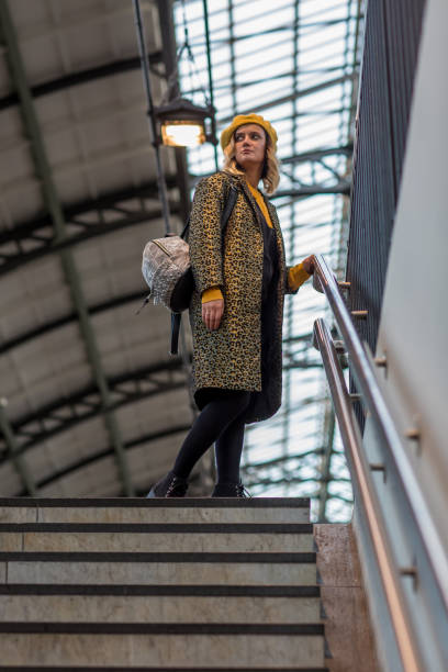istock Young stylish woman at central train station 1175696058