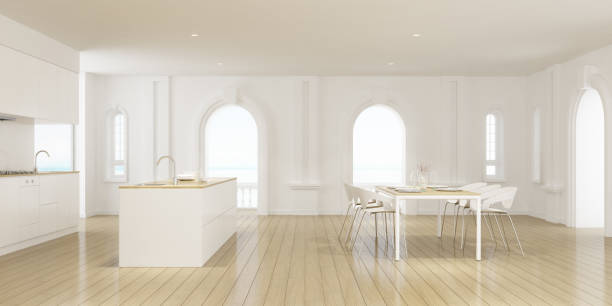 perspektywa luksusowego pokoju kuchennego ze stołem i nowoczesną białą wyspą laminowaną na tle morza, klasycznym wystrojem wnętrz, renderowaniem 3d. - table chair white curve zdjęcia i obrazy z banku zdjęć