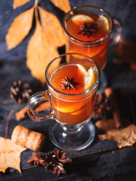 istock Two glasses of grog alcoholic drink or mulled wine on a dark table 1175697614