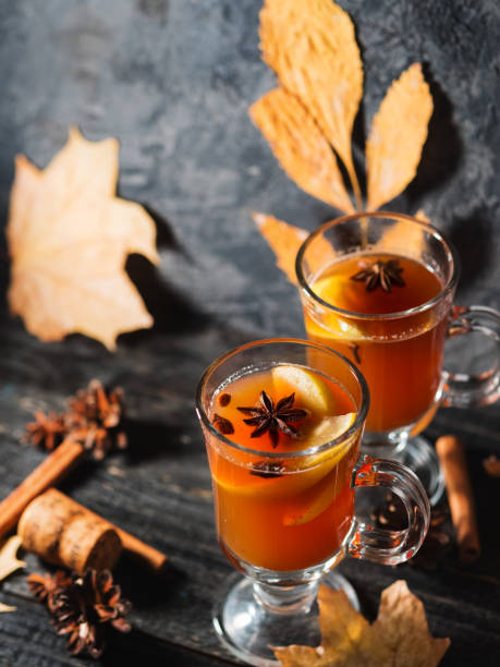 istock Two glasses of grog alcoholic drink or mulled wine on a dark table 1175697665
