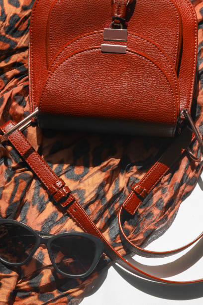 istock Women accessories light scarf leopard print black glasses bag Copy space Vertical 1175698825