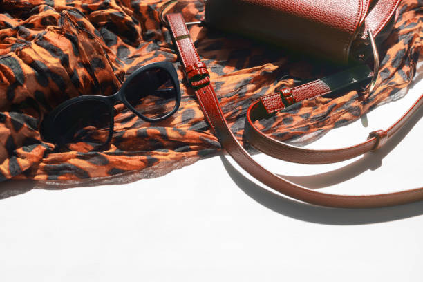 istock Women accessories light scarf leopard print black glasses bag Copy space 1175698829