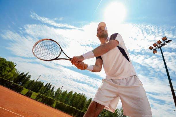 istock Tennis balls and racket on red dross 1175699226