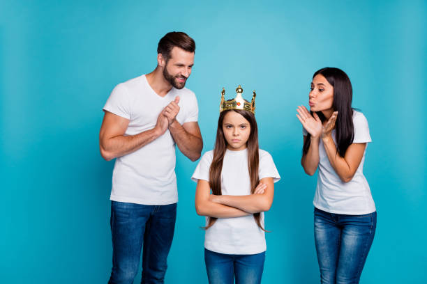 daddy mommy proud of small lady wearing diadem hate being princess isolated blue background - real people blue white friendship imagens e fotografias de stock