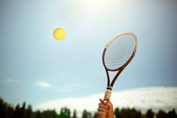 istock Tennis balls and racket on red dross 1175700278
