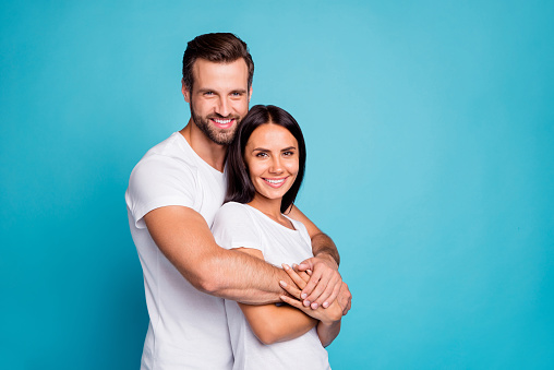 Photo of pair in love standing piggy back, together wear casual outfit isolated blue background