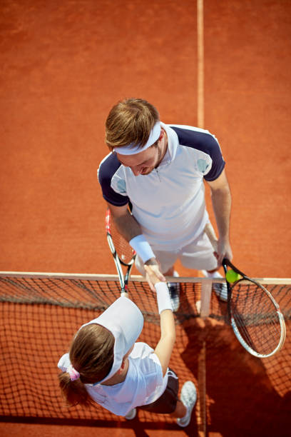 istock Tennis balls and racket on red dross 1175700691