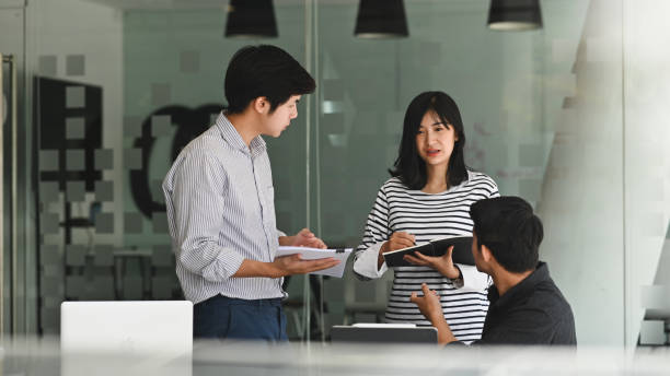 istock Young business meeting with startup project in modern office. 1175700976