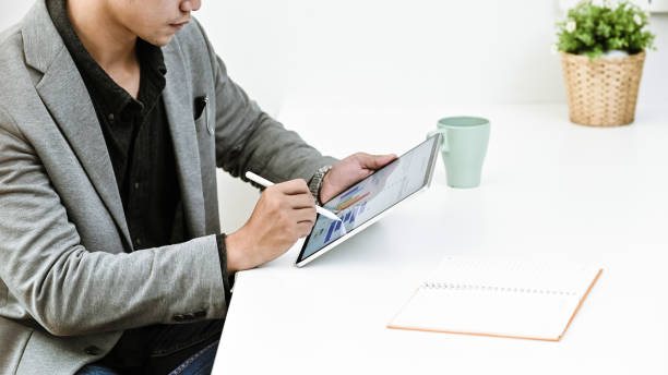 istock Cropped shot businessman analysis financial data in tablet. 1175701007