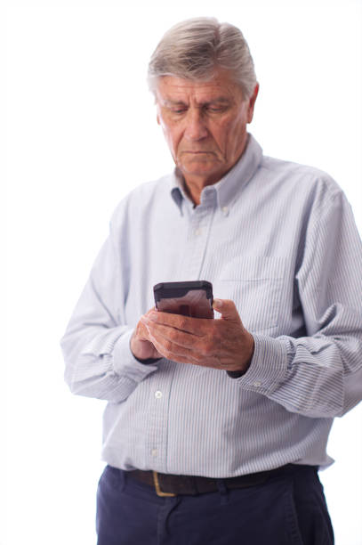Senior Male on mobile phone typing cut out in Cape Town South Africa