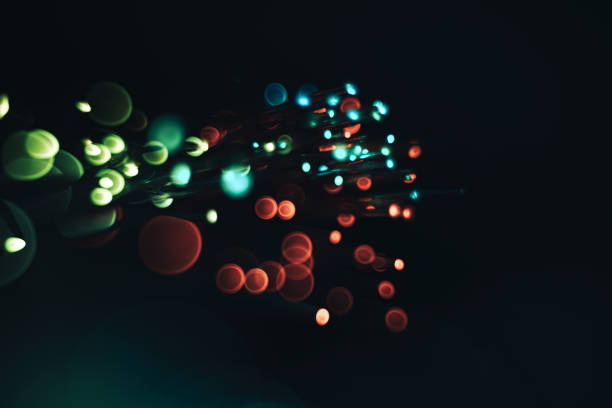 istock Beautiful multi colored optical abstract light bokeh on a dark background. 1175703562