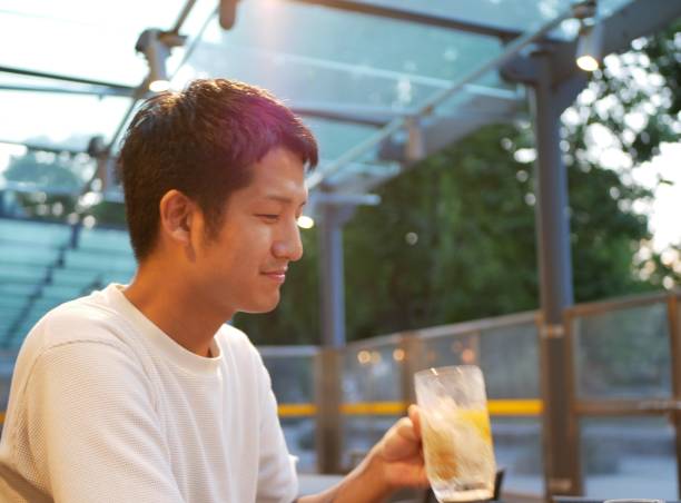 istock A Japanese man is drinking at a terrace seat. 1175706540