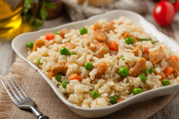 istock Delicious risotto with chicken and green peas. 1175706861