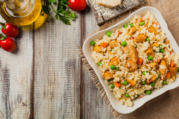 istock Delicious risotto with chicken and green peas. 1175706872