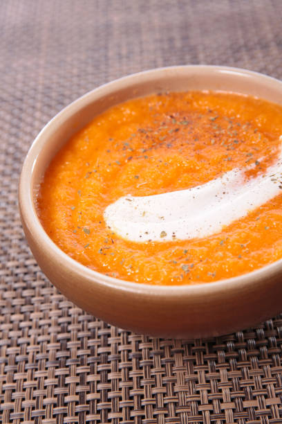 istock pumpkin or carrot soup and cream 1175709126