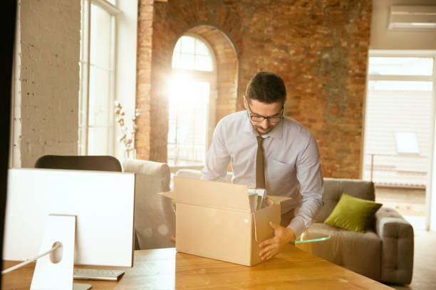 istock A young businessman moving in office, getting new work place 1175709442