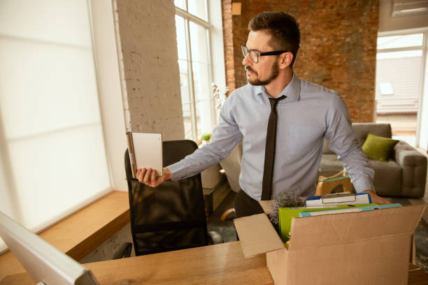 istock A young businessman moving in office, getting new work place 1175709467