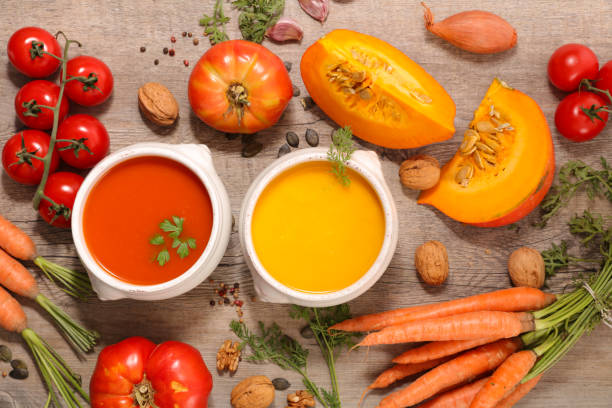 istock carrot soup and tomato soup with ingredients 1175709595