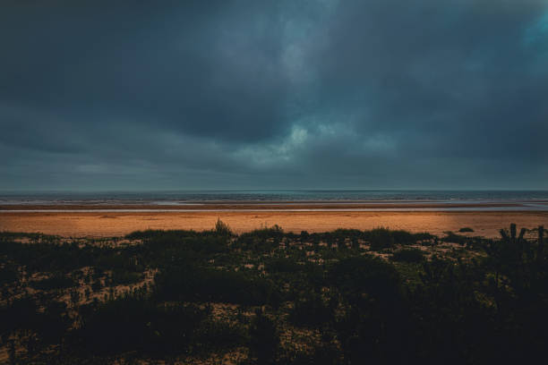 The Beach Under The Sea Of clouds