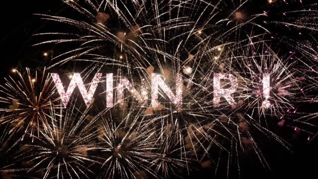 Winner text animation with a splendid fireworks on black night sky, typography design - Event concept