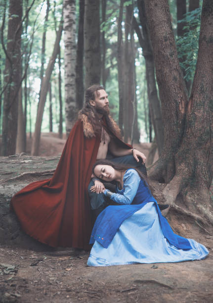 istock Brave Warrior Viking man with beautiful medieval woman 1175712254