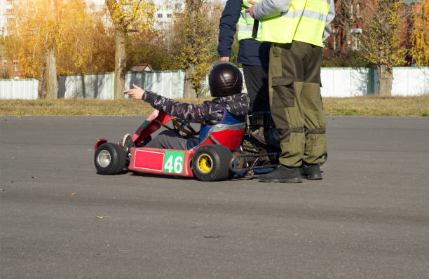 istock Karting competitions, a karting participant performs time maneuvers, motor racing, driver 1175719000