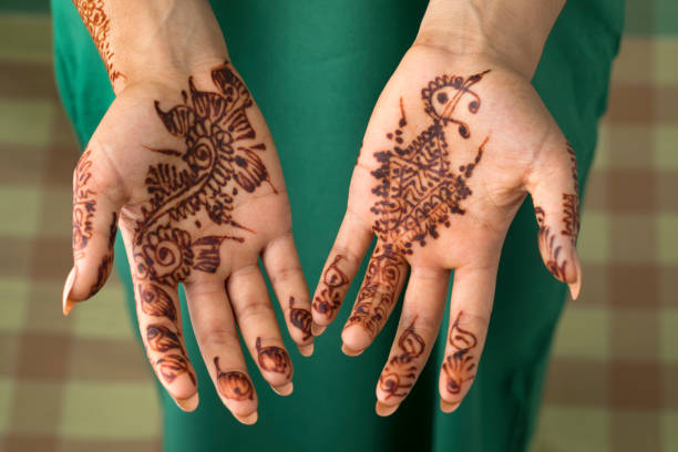 istock Moroccan woman with henna painted hands 1175720233