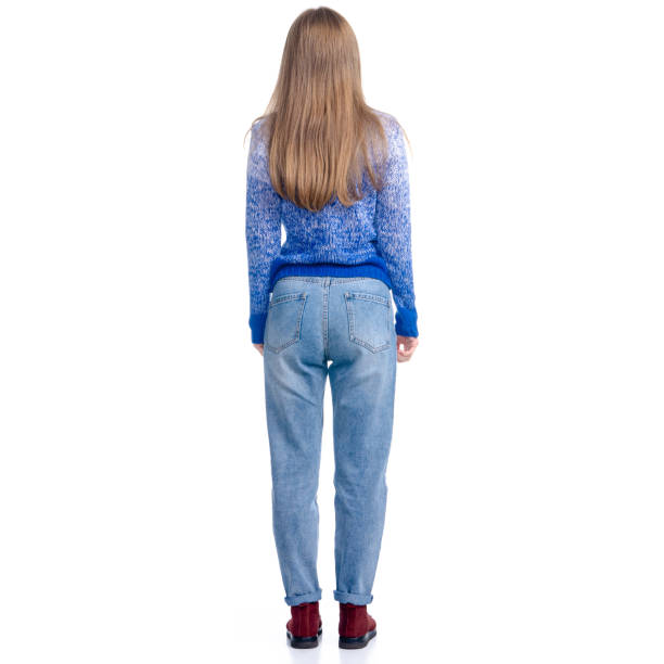 istock Woman in jeans and blue sweater looking standing 1175720844