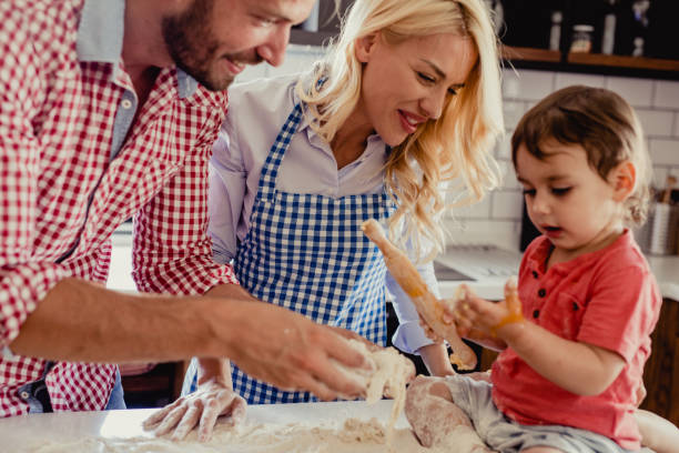 istock Parents with a child in the kitchen 1175721047