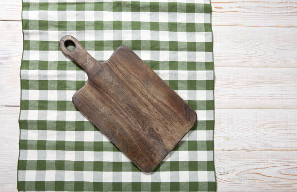 istock Cutting board on the wooden background. Top view. 1175721213