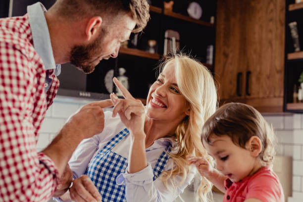 istock Parents with a child in the kitchen 1175721299