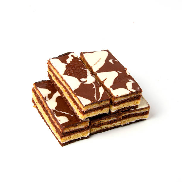 istock Milk and chocolate rectangular pieces of cake isolated on white background 1175722196