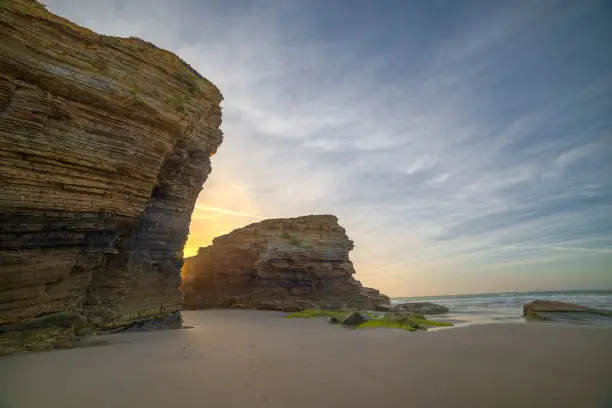 sunset on the cliffs of the beach of Las Catedrales, Ribadeo, Lugo, Galicia
